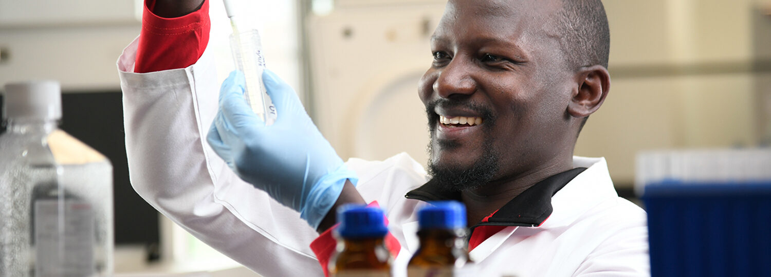 Bonny Oloka analyzing test tube DNA